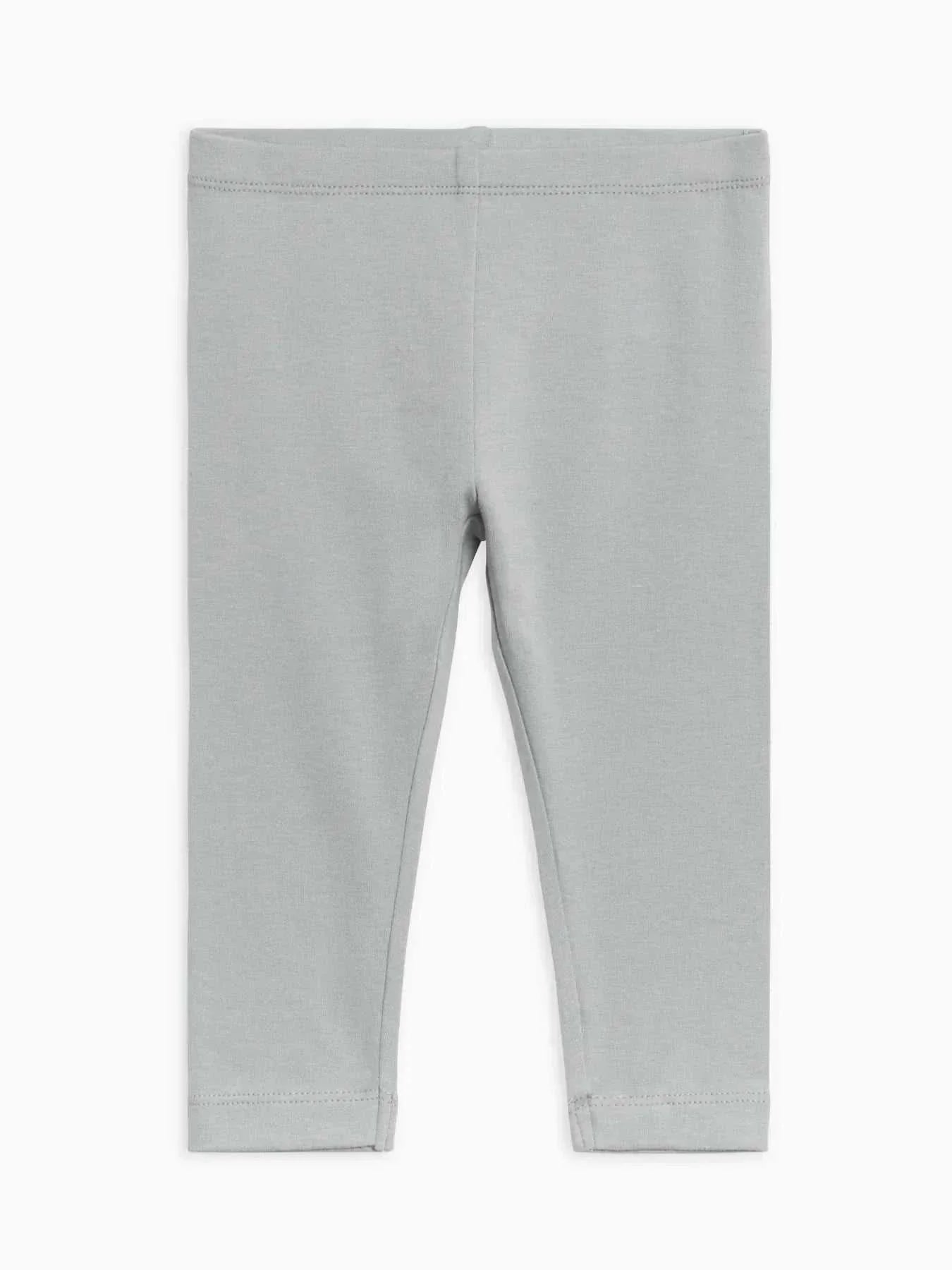 Organic gray leggings for kids made from 95% organic cotton and 5% elastane, offering comfort and stretch.