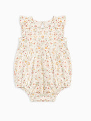 Adorable Sommer Romper with floral design, ruffle sleeves, and gathered waist, made from organic cotton.