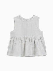 Seersucker Peplum Top with wooden button detail, made of organic cotton.