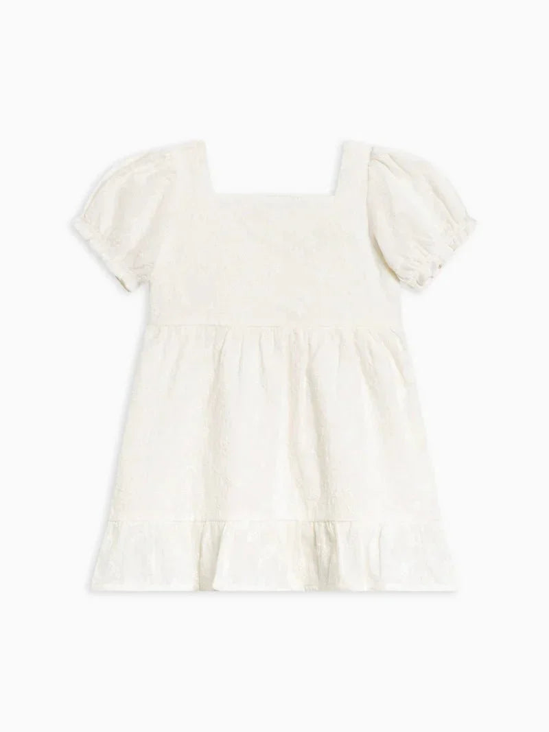 Briar Eyelet Puff Sleeve Dress for children in white organic cotton with puff sleeves and ruffle hem.
