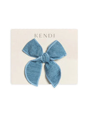 Organic chambray bow clip on cream card.