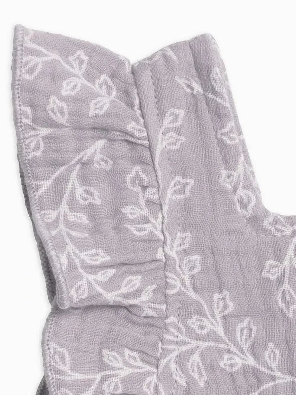 Charming Jane Muslin Dress with delicate ruffles and leaf pattern.