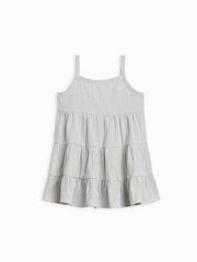 Organic cotton seersucker tiered dress with gathered waist and wooden button closure.