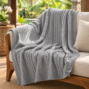 Gray organic cable-knit blanket in a Bali-inspired reading nook