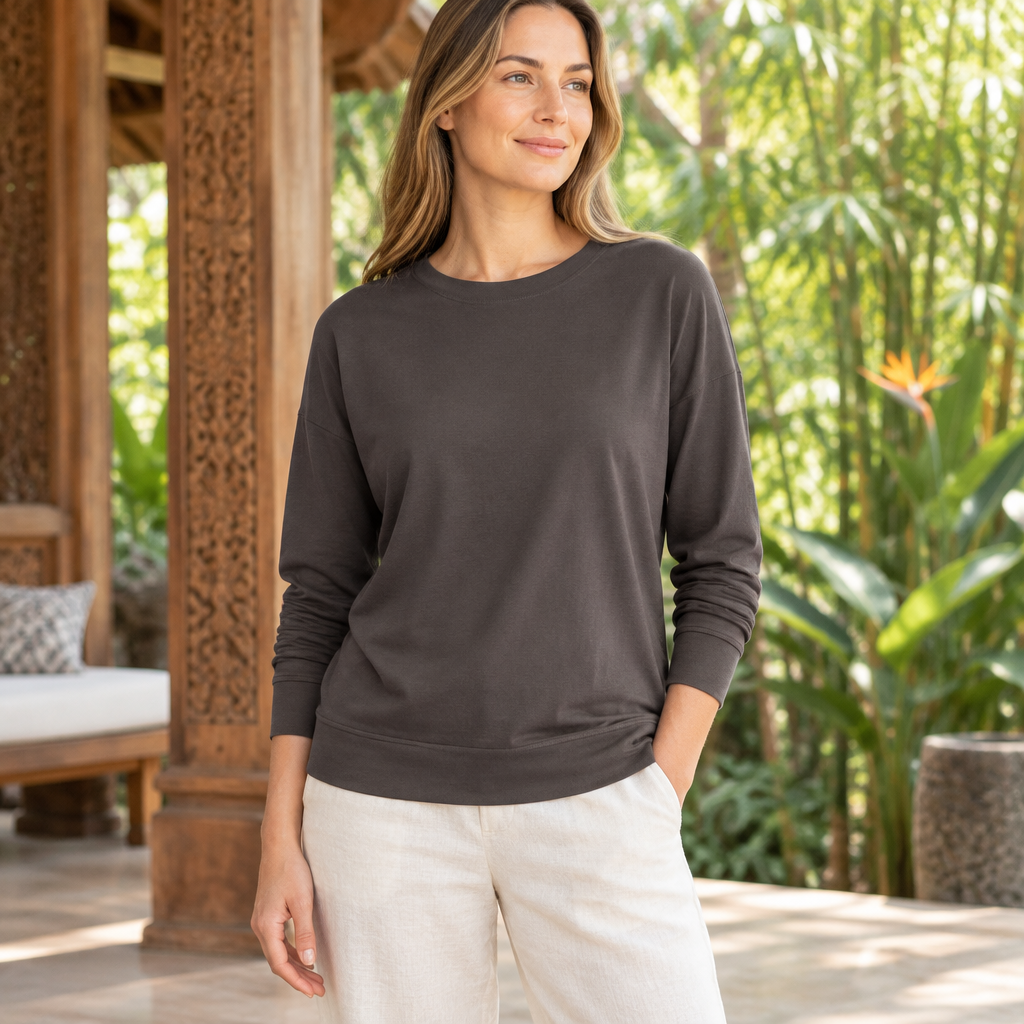 Women's organic cotton pullover in a serene Bali-inspired setting