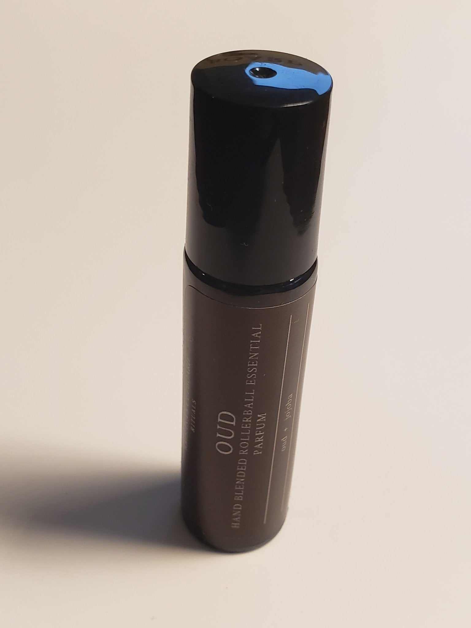 Oud Roll-On bottle featuring luxury organic ingredients for on-the-go indulgence.
