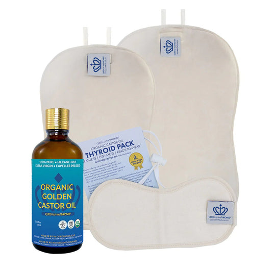 a bottle of organic golden castor oil next to an oven mitt