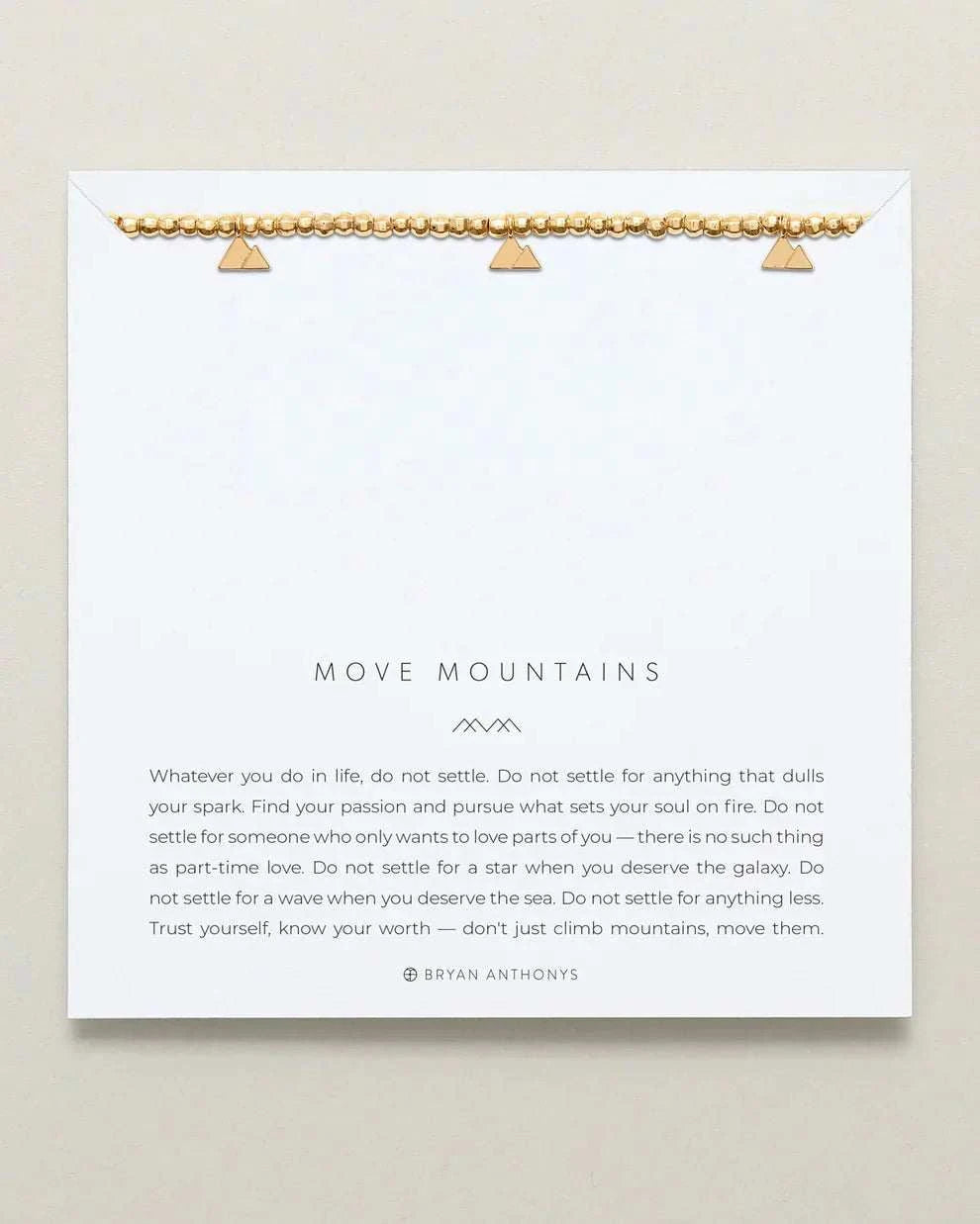 MOVE MOUNTAINS beaded bracelet with gold finish, symbolizing determination and self-belief.
