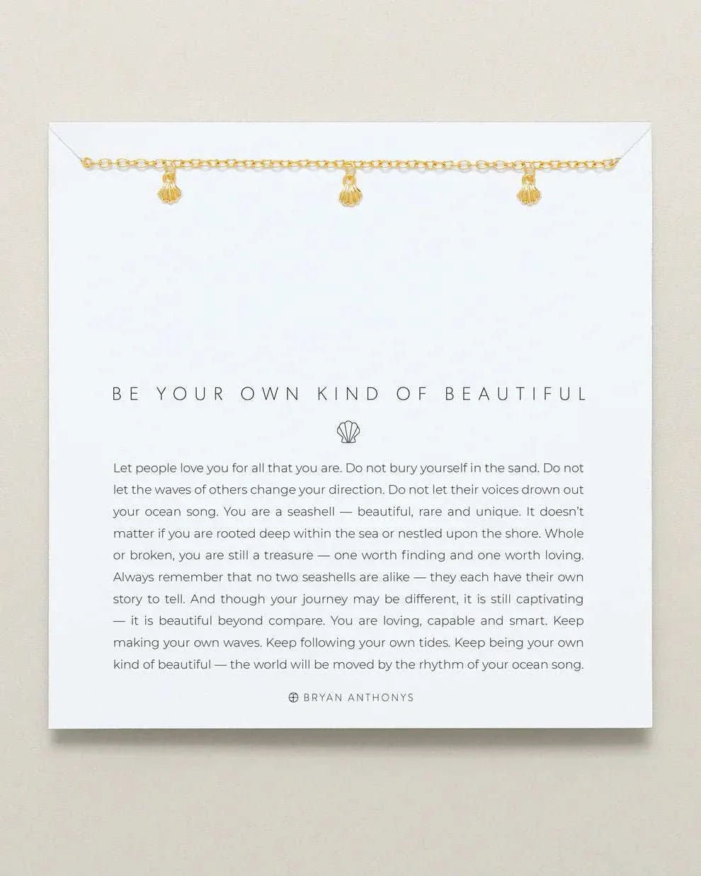 BE YOUR OWN KIND OF BEAUTIFUL necklace by Bryan Anthonys with gold chain and seashell charm.