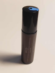Oud Roll-On bottle featuring luxury organic ingredients for on-the-go indulgence.