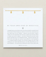 BE YOUR OWN KIND OF BEAUTIFUL necklace by Bryan Anthonys with gold chain and seashell charm.